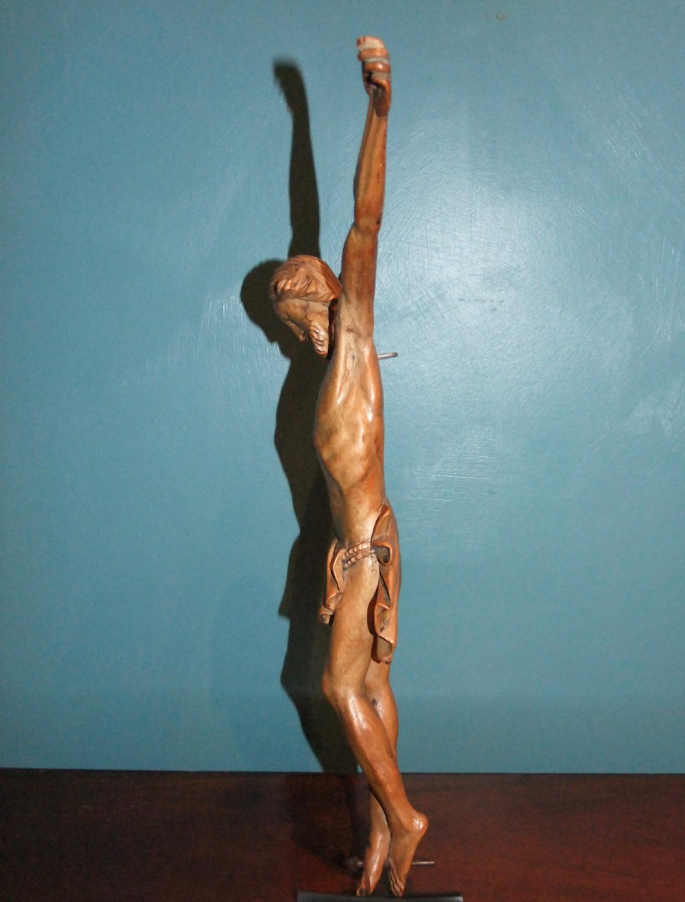 An 18th-century carved fruitwood figure of Corpus Christi showing anatomical detail and draped loincloth against a plain background. View IX