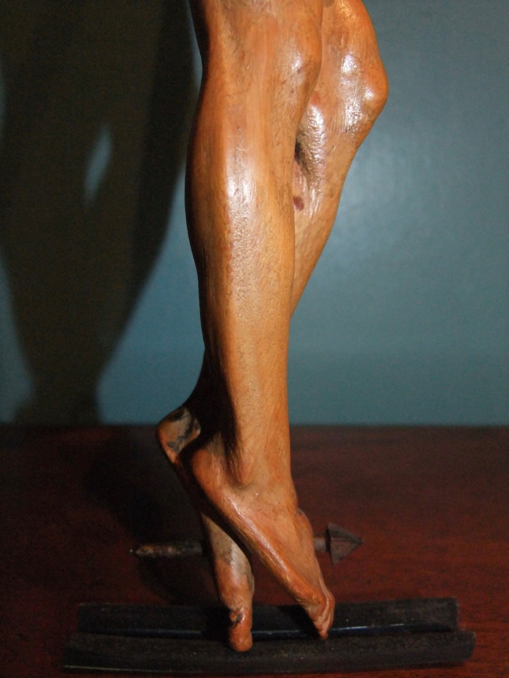 An 18th-century carved fruitwood figure of Corpus Christi showing anatomical detail and draped loincloth against a plain background. View XIII