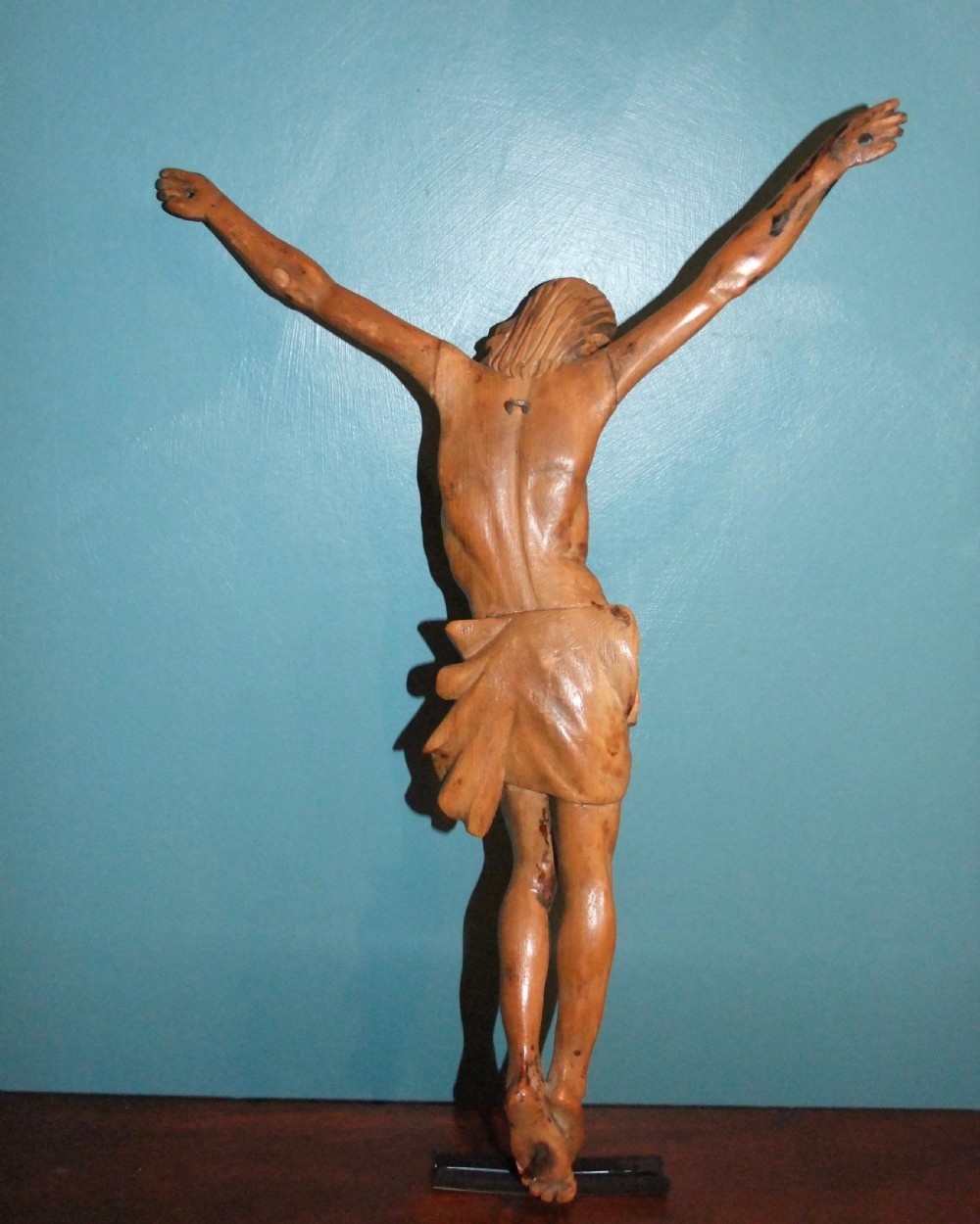 An 18th-century carved fruitwood figure of Corpus Christi showing anatomical detail and draped loincloth against a plain background. View XIV