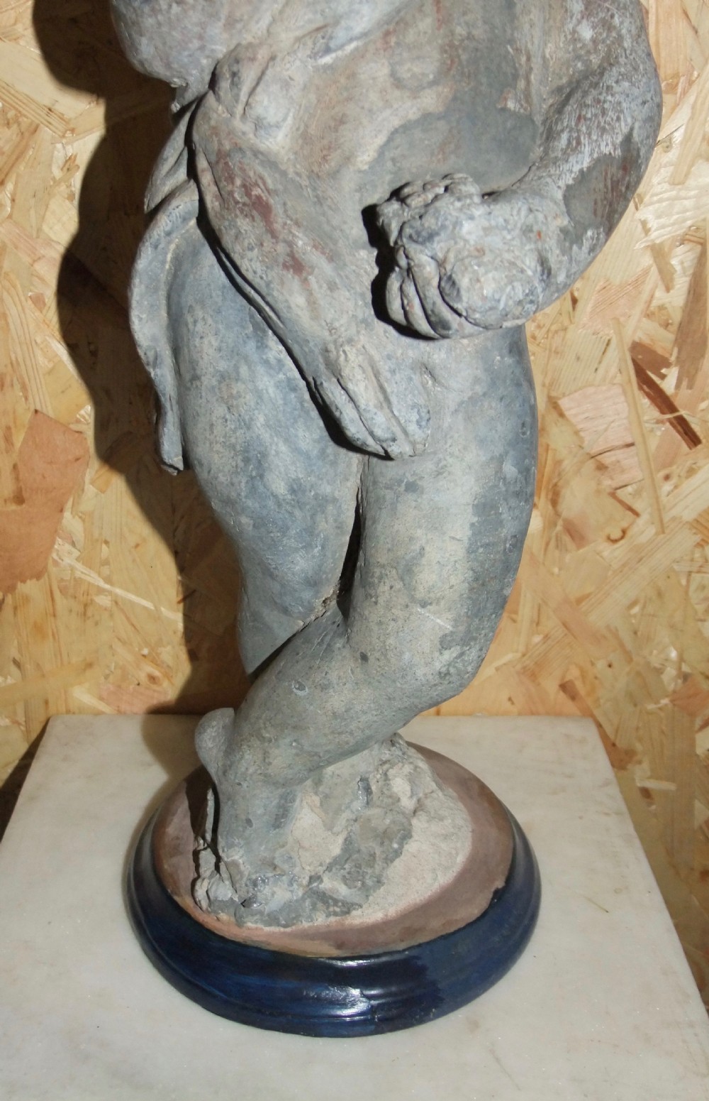 A pair of eighteenth-century Georgian cast lead garden statues depicting standing putti draped in classical fabric. View XVI