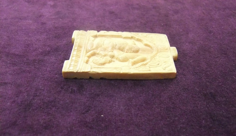 An 18th-century cream-coloured carved relief panel depicting figures within an architectural arch. View IX