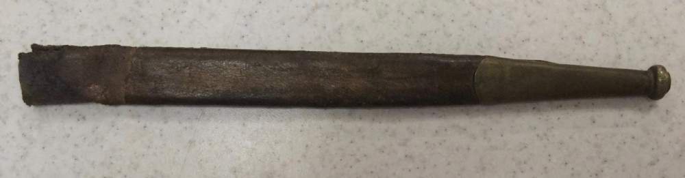 An antique French Napoleonic naval dagger with a tapered steel blade, ornate brass guard, turned dark grip, and leather scabbard. View XII