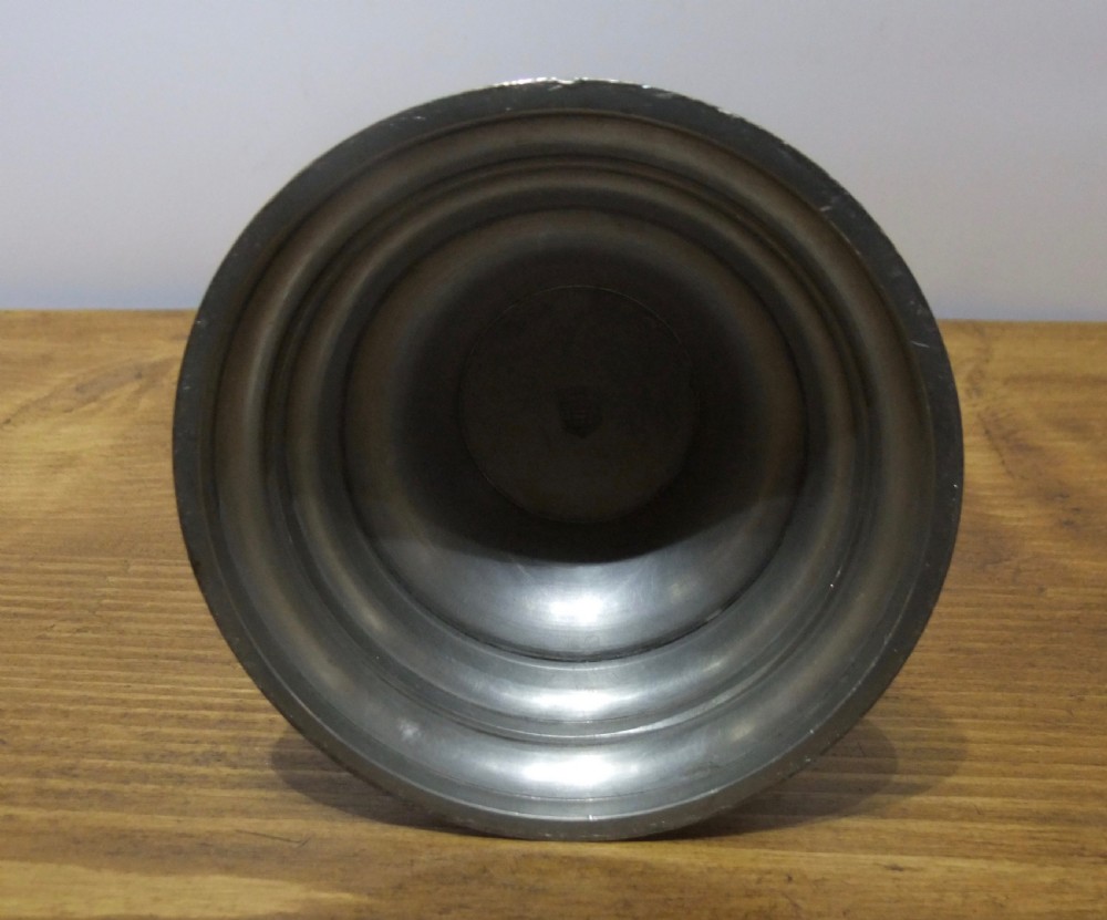 A tall 19th-century German lidded pewter tankard featuring hand-engraved Masonic iconography, floral sprigs, German text, a hinged lid with finial, and a flared pedestal base. View XIII
