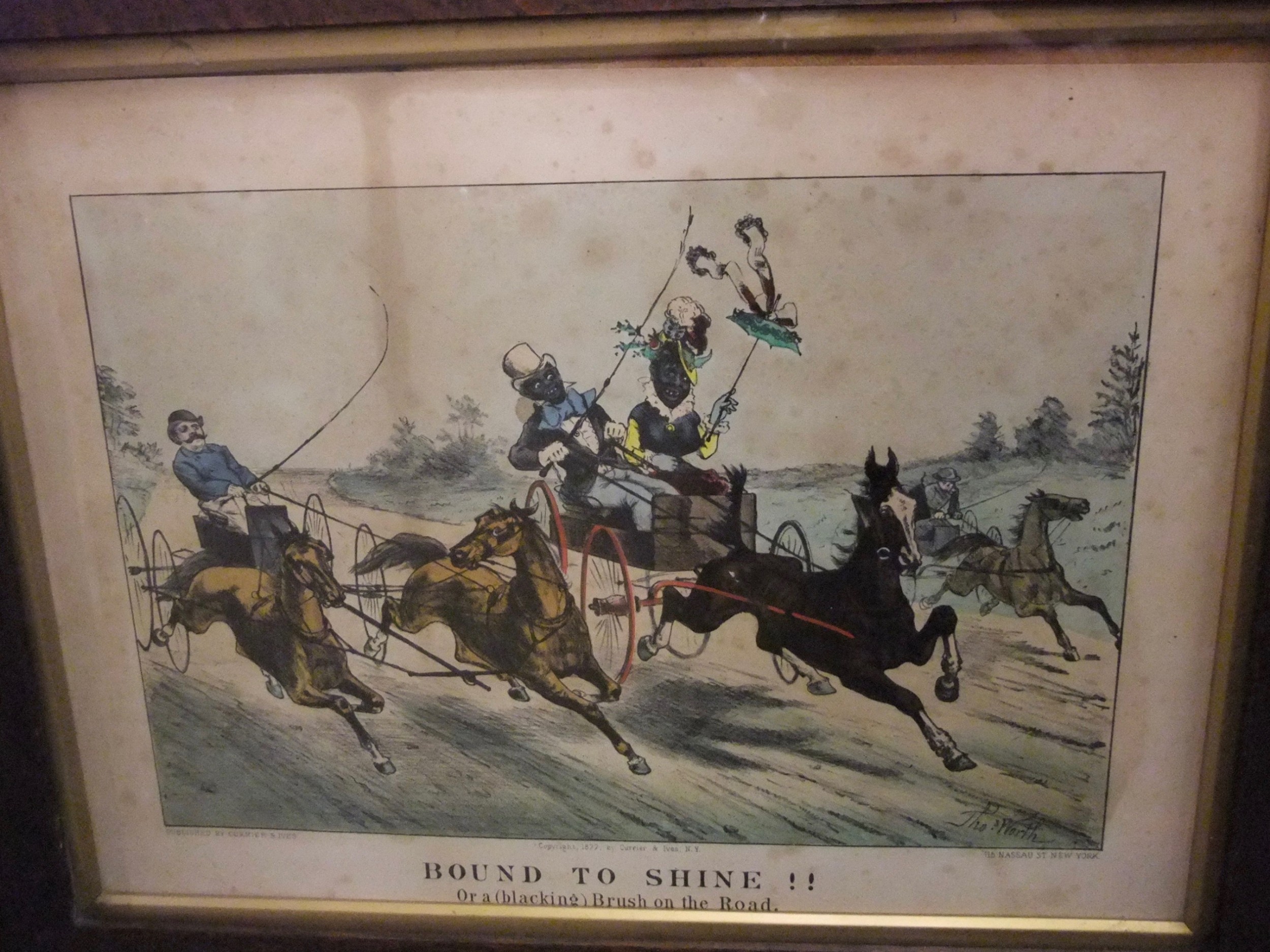 A framed nineteenth-century hand-coloured lithograph titled Bound to Shine featuring horse-drawn carriages in motion.