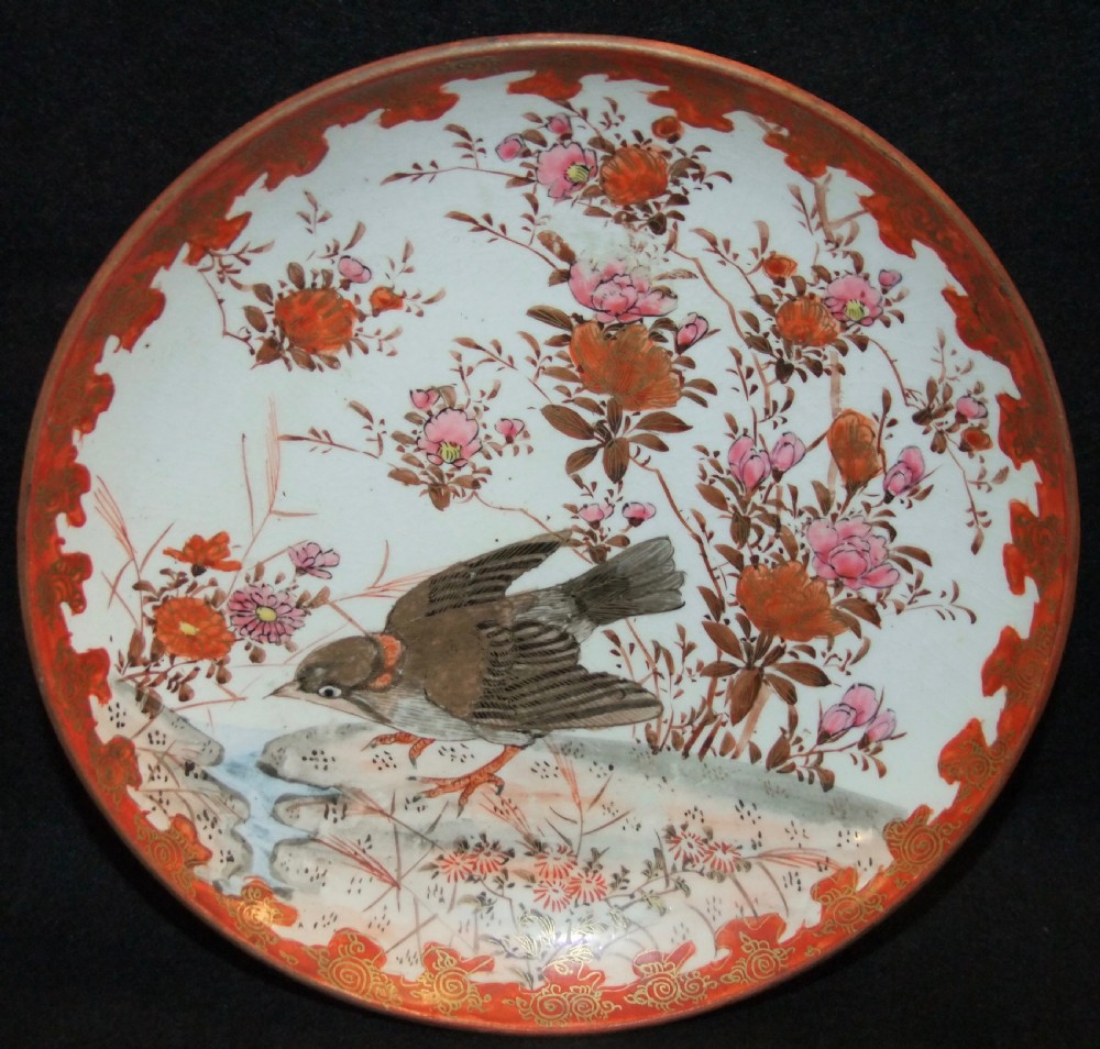 A pair of circular Japanese Kutani porcelain plates decorated with hand-painted sparrows, floral branches, and iron-red gilt borders. View II