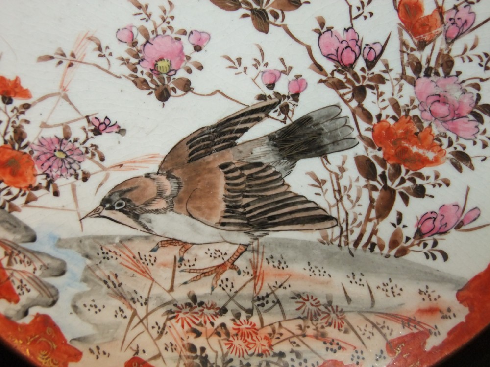 A pair of circular Japanese Kutani porcelain plates decorated with hand-painted sparrows, floral branches, and iron-red gilt borders. View IV