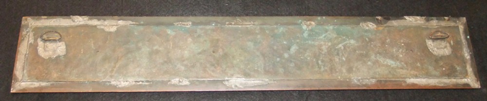 A long horizontal dark bronze relief frieze featuring classical cherubs engaged in allegorical scenes set within a slender rectangular frame. View XIII