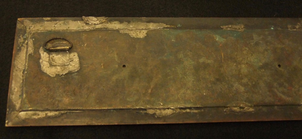 A long horizontal dark bronze relief frieze featuring classical cherubs engaged in allegorical scenes set within a slender rectangular frame. View XIV
