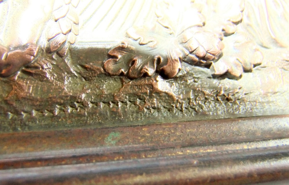 A long horizontal dark bronze relief frieze featuring classical cherubs engaged in allegorical scenes set within a slender rectangular frame. View XVII