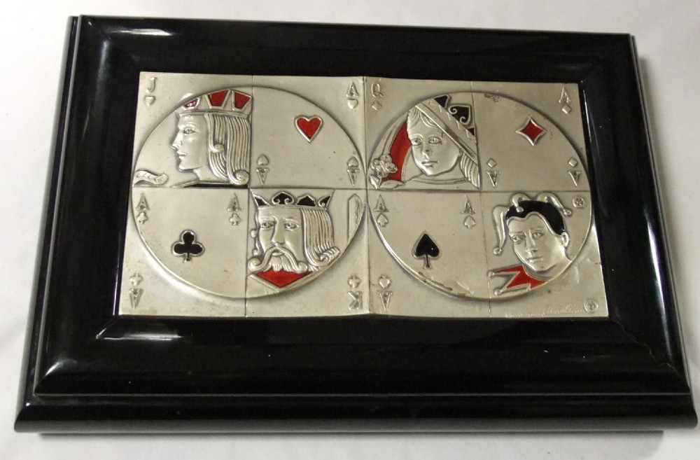 A rectangular black lacquer box featuring an inset silver and enamel lid panel depicting playing card faces and suit motifs. View II