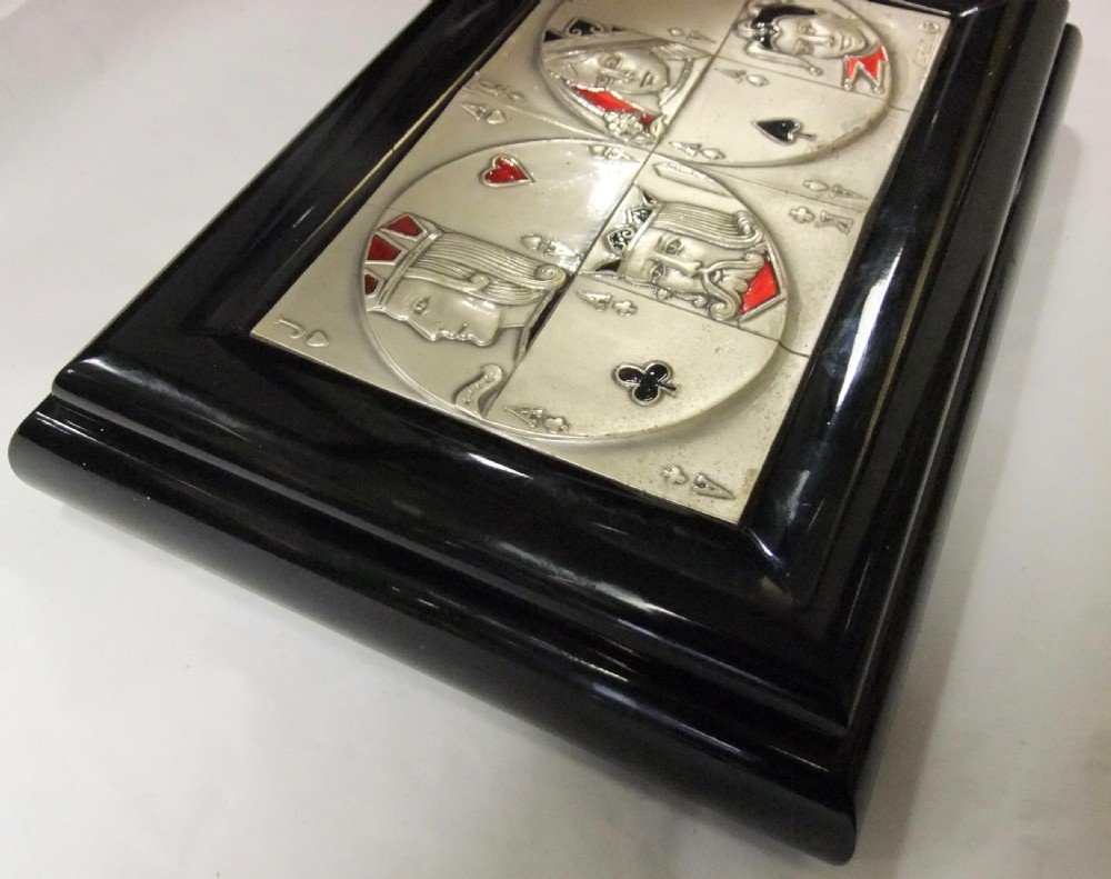 A rectangular black lacquer box featuring an inset silver and enamel lid panel depicting playing card faces and suit motifs. View III