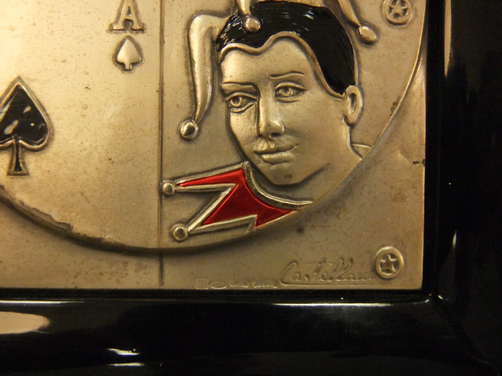 A rectangular black lacquer box featuring an inset silver and enamel lid panel depicting playing card faces and suit motifs. View VII
