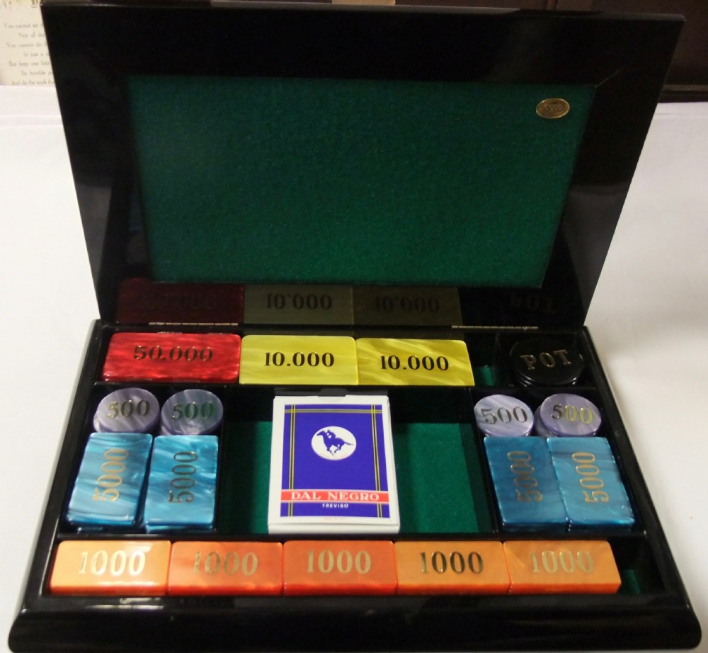 A rectangular black lacquer box featuring an inset silver and enamel lid panel depicting playing card faces and suit motifs. View IX