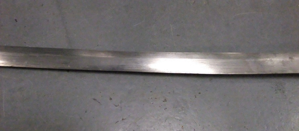 A Japanese WWII officers Shin-Gunto katana featuring a leather-wrapped scabbard, ribbed handle, and brass tsuba. View XIII