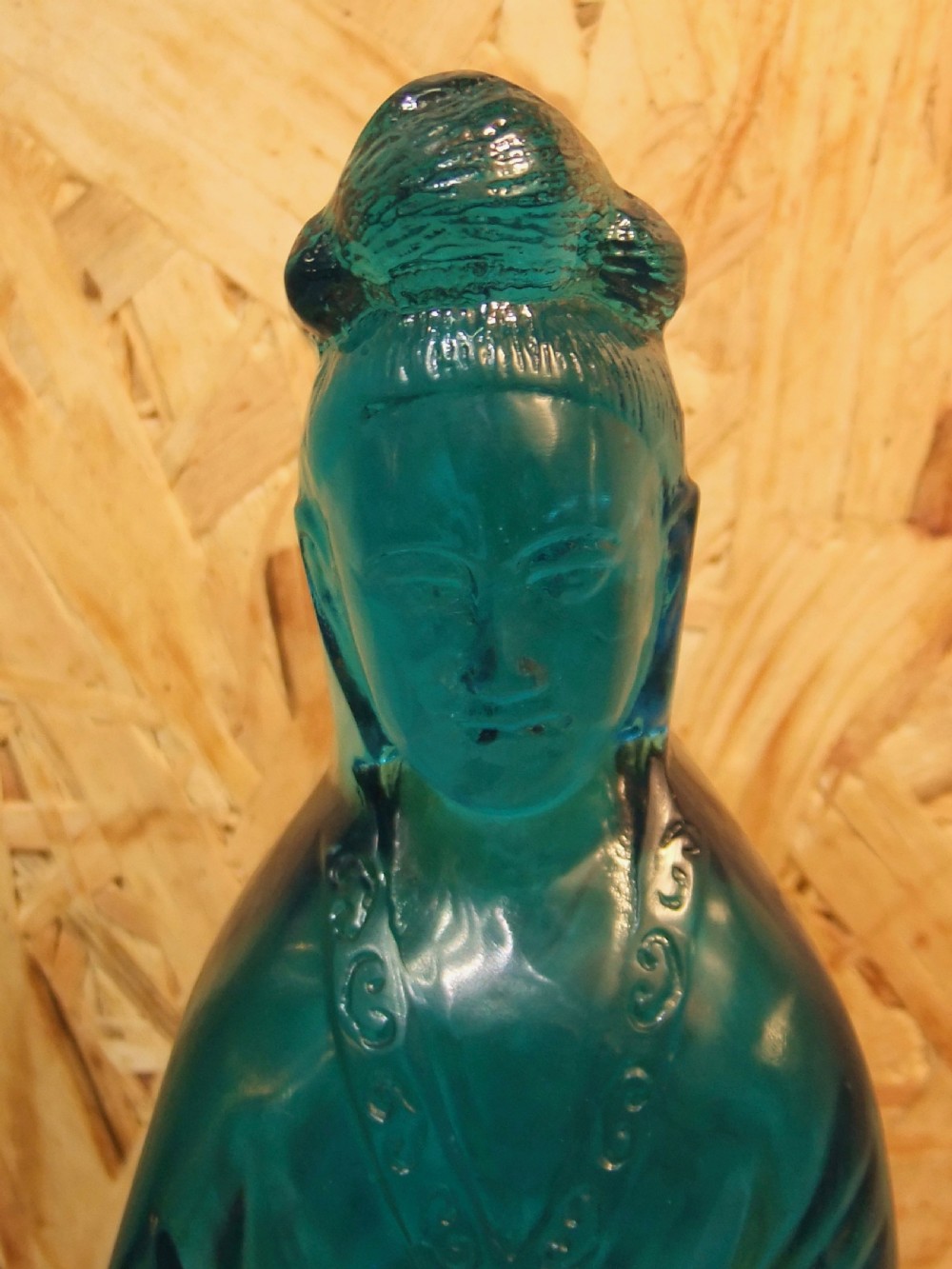 A 19th-century turquoise blue translucent Peking glass figurine depicting the Bodhisattva Guanyin standing in traditional robes. View V