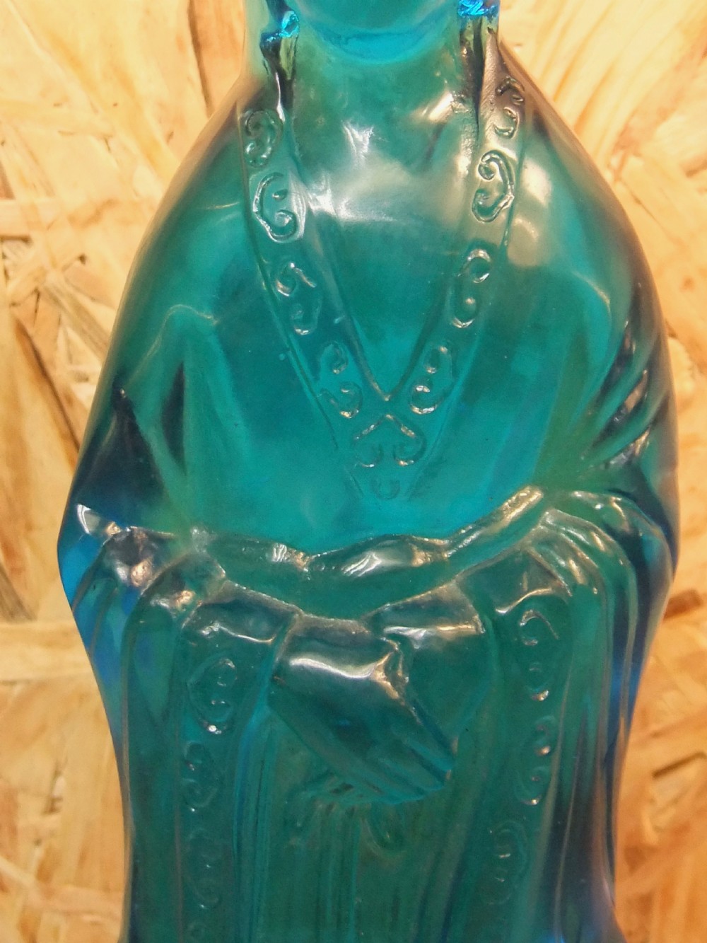A 19th-century turquoise blue translucent Peking glass figurine depicting the Bodhisattva Guanyin standing in traditional robes. View VIII