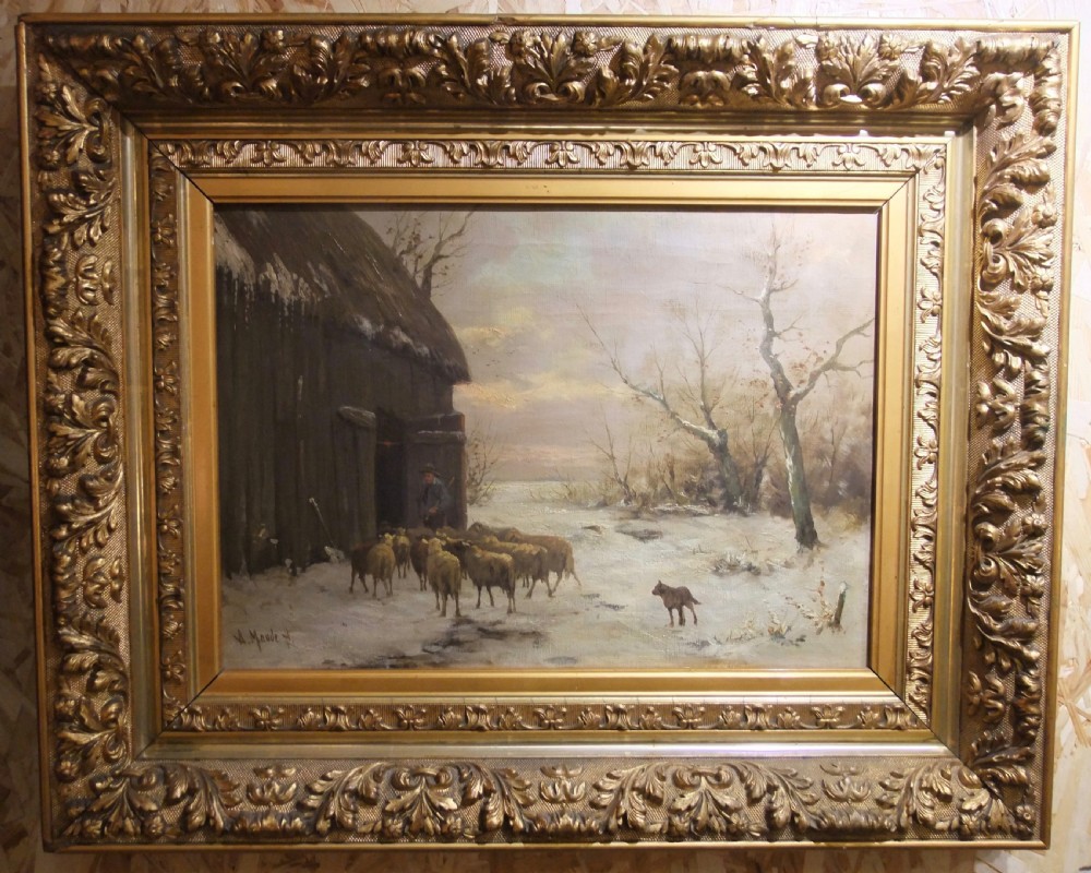 A framed 19th-century oil painting depicting a shepherd leading a flock of sheep into a barn during a snowy winter landscape, housed in a gold gilt frame. View IV