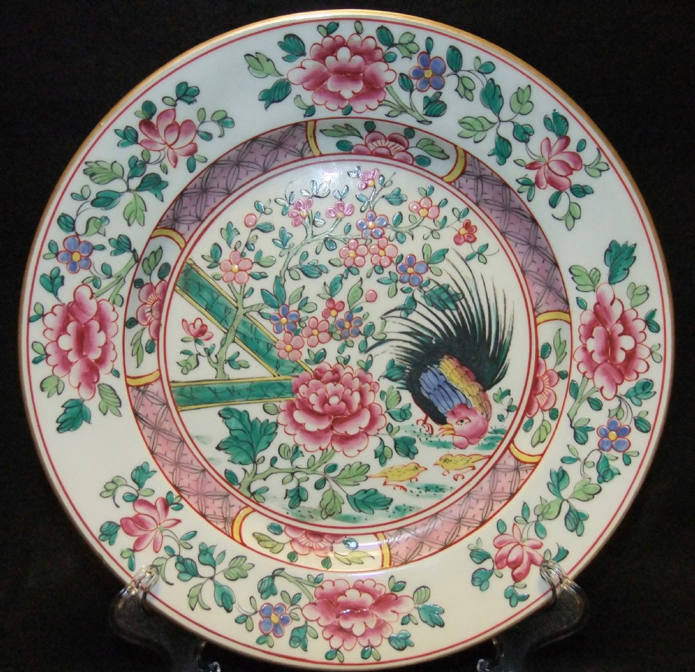 A pair of circular Chinese export porcelain plates decorated with hand-painted roosters, peonies, and pink and green floral borders. View II