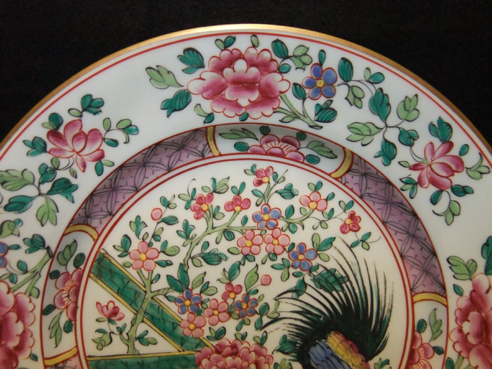 A pair of circular Chinese export porcelain plates decorated with hand-painted roosters, peonies, and pink and green floral borders. View IV