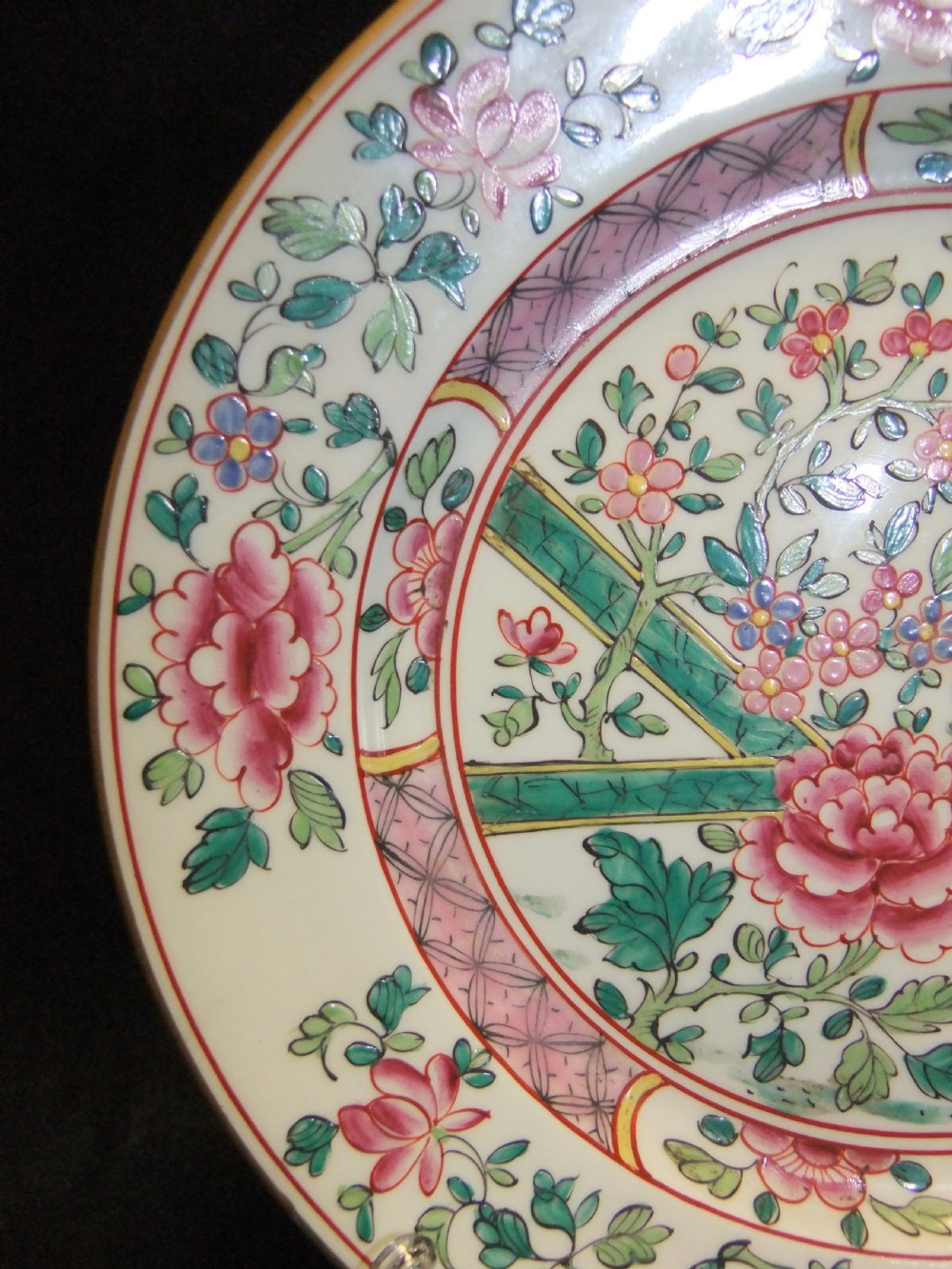 A pair of circular Chinese export porcelain plates decorated with hand-painted roosters, peonies, and pink and green floral borders. View VII