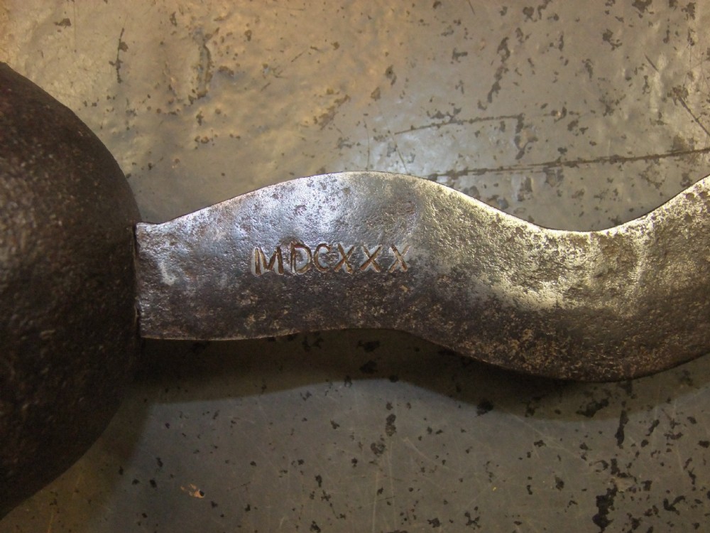 A 17th-century steel cup-hilt sword featuring a long wavy flamberge blade and a rounded metal hand guard. View XIV