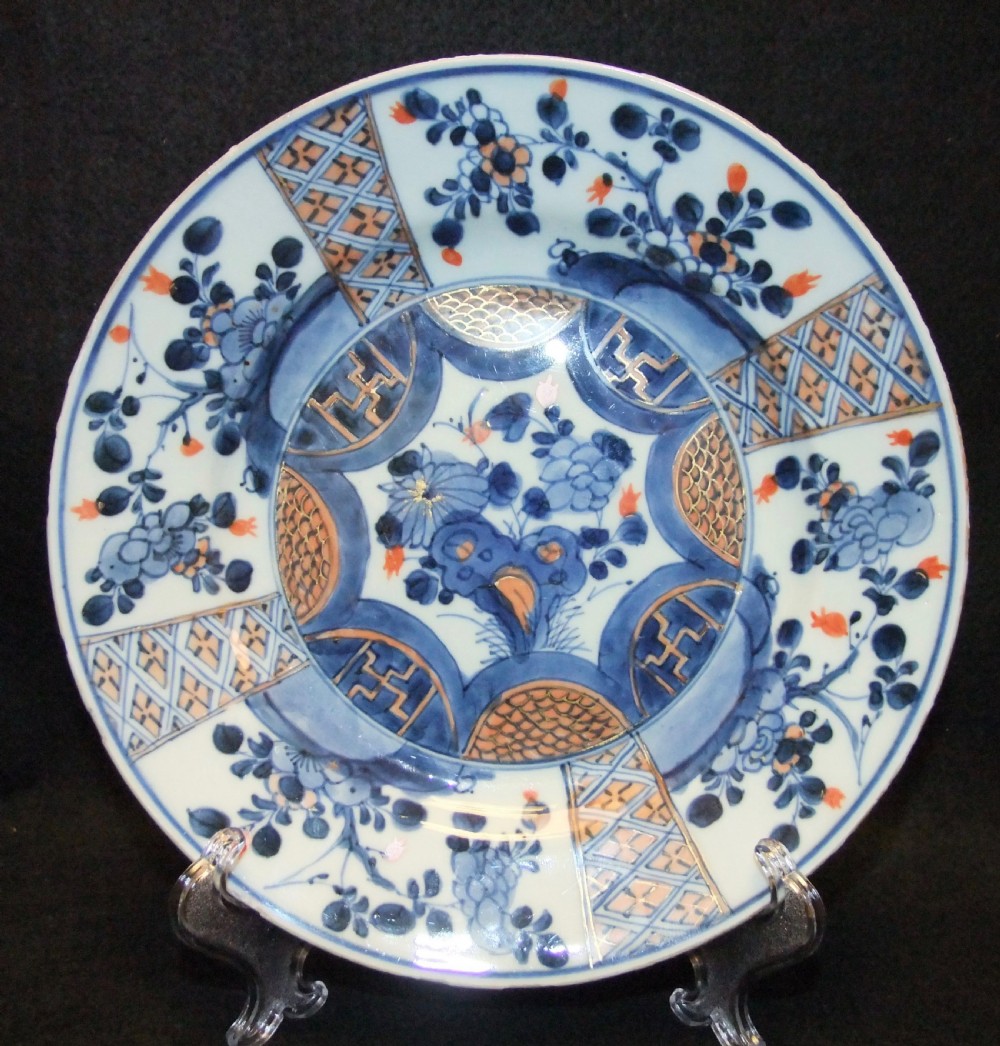 A set of six Chinese Imari porcelain plates featuring cobalt blue, iron red, and gilded floral motifs. View III