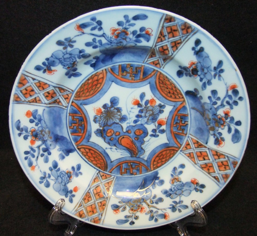 A set of six Chinese Imari porcelain plates featuring cobalt blue, iron red, and gilded floral motifs. View VI