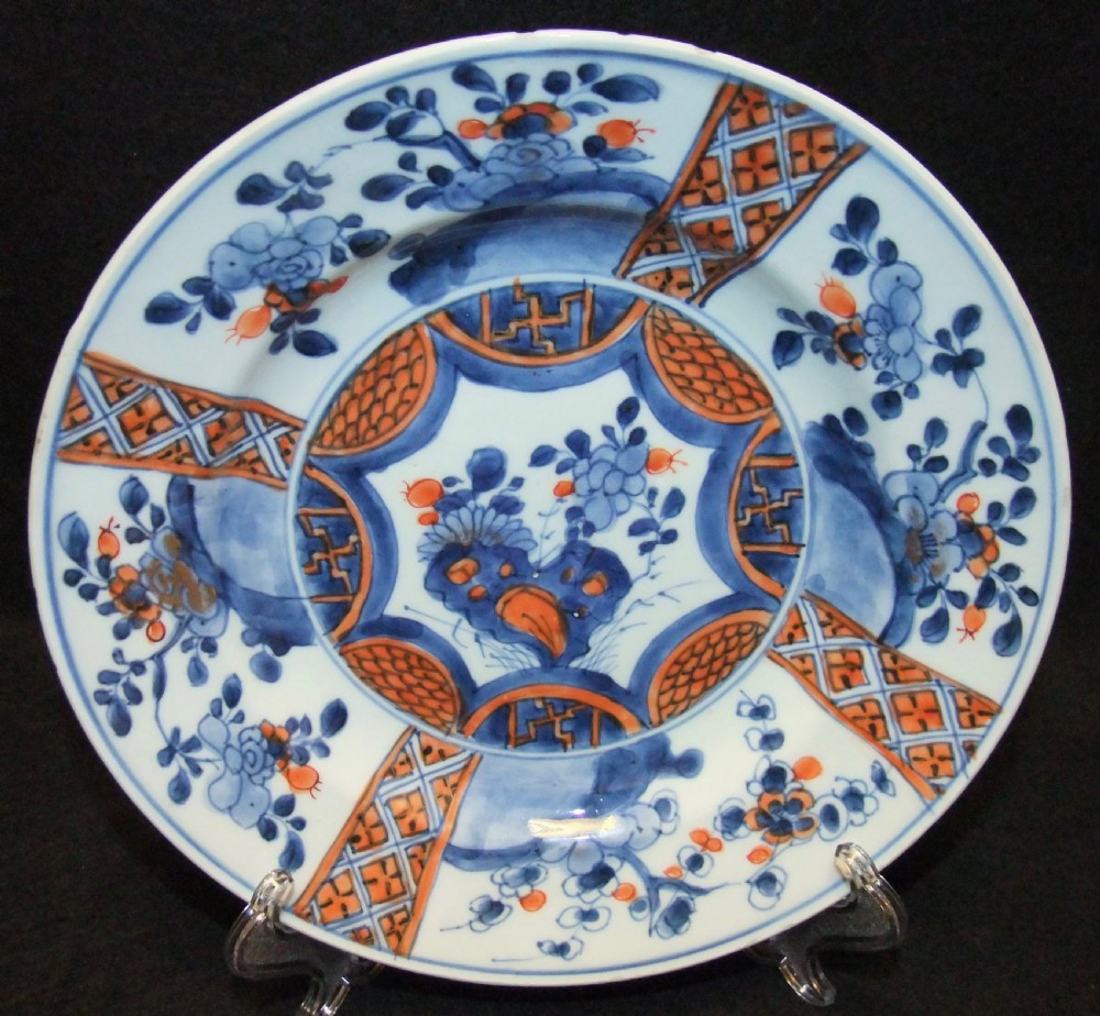 A set of six Chinese Imari porcelain plates featuring cobalt blue, iron red, and gilded floral motifs. View VII