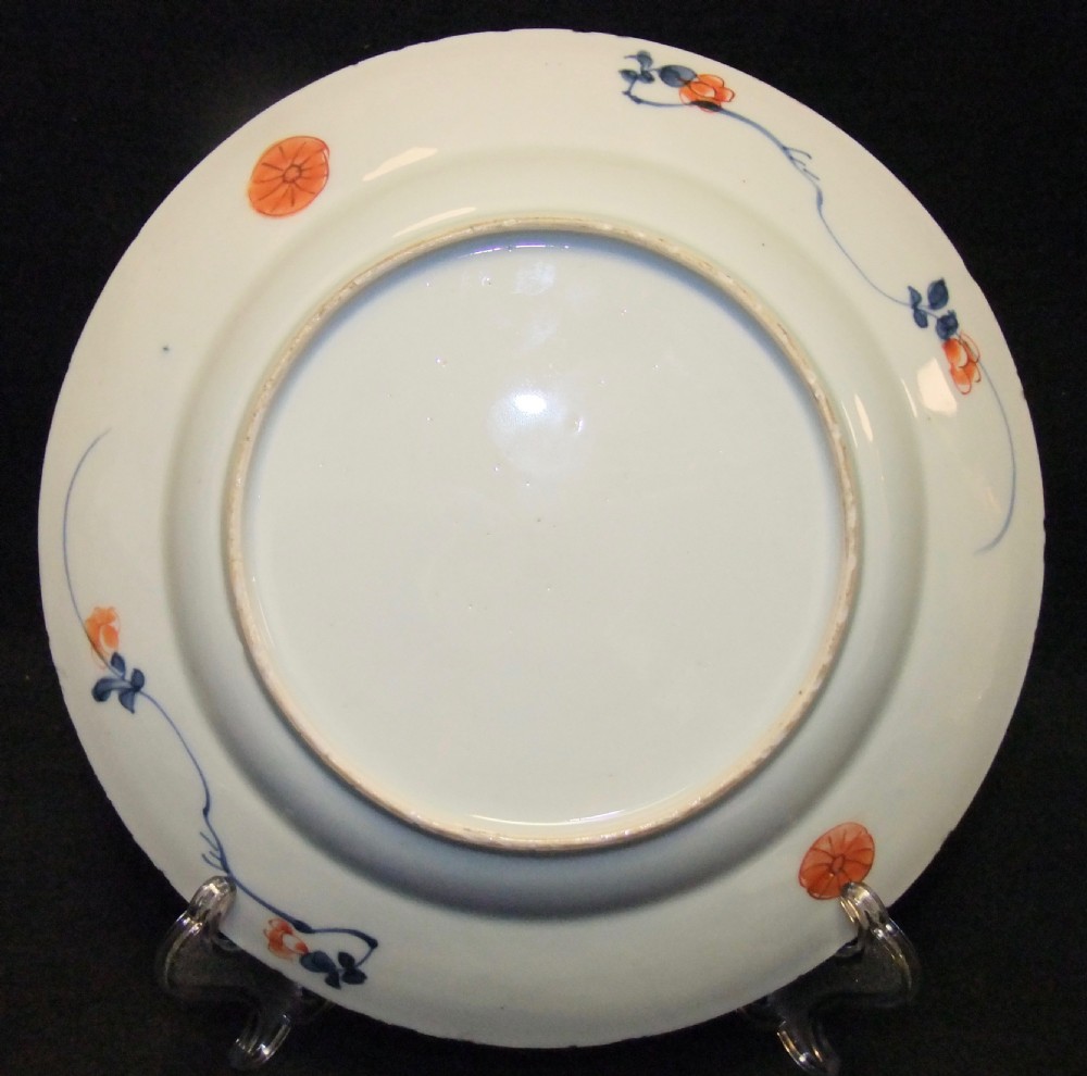 A set of six Chinese Imari porcelain plates featuring cobalt blue, iron red, and gilded floral motifs. View VIII
