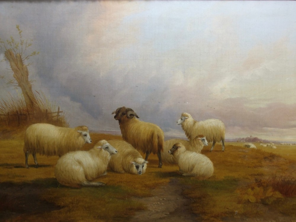 A nineteenth-century pastoral oil painting depicting a flock of sheep and a horned ram resting in an open field under a cloudy sky.