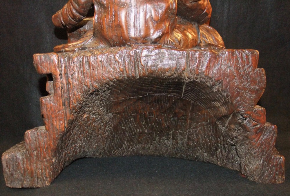 A medieval hand-carved oak sculpture depicting the Virgin Mary cradling the body of Christ. View IV