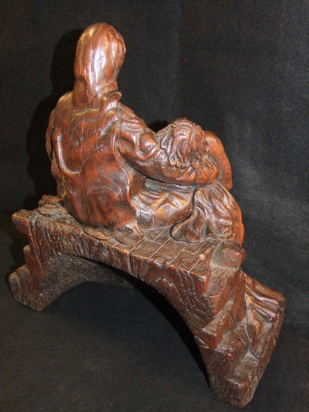 A medieval hand-carved oak sculpture depicting the Virgin Mary cradling the body of Christ. View V