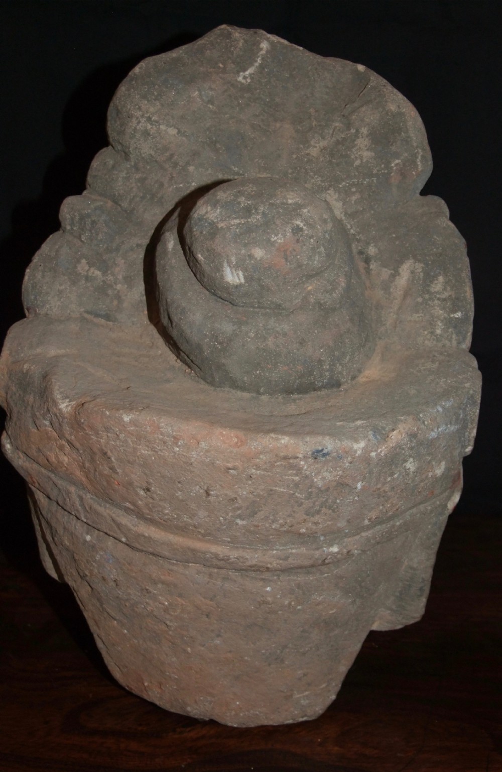Carved sandstone head of Avalokiteshvara featuring an elaborate crown, gentle facial contours, and visible traces of red and green pigment. View VII