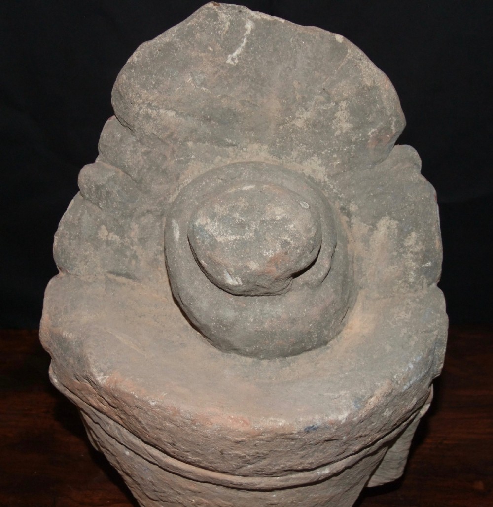 Carved sandstone head of Avalokiteshvara featuring an elaborate crown, gentle facial contours, and visible traces of red and green pigment. View VIII