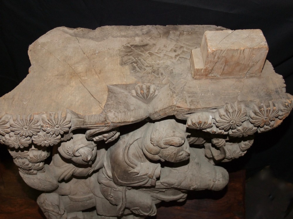 A pair of deeply carved natural timber architectural corbels depicting figures mounted on horses amidst floral motifs. View VIII