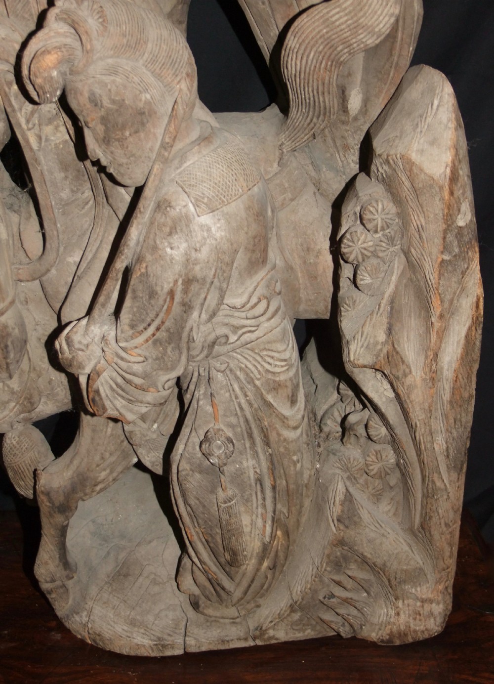 A pair of deeply carved natural timber architectural corbels depicting figures mounted on horses amidst floral motifs. View XIII