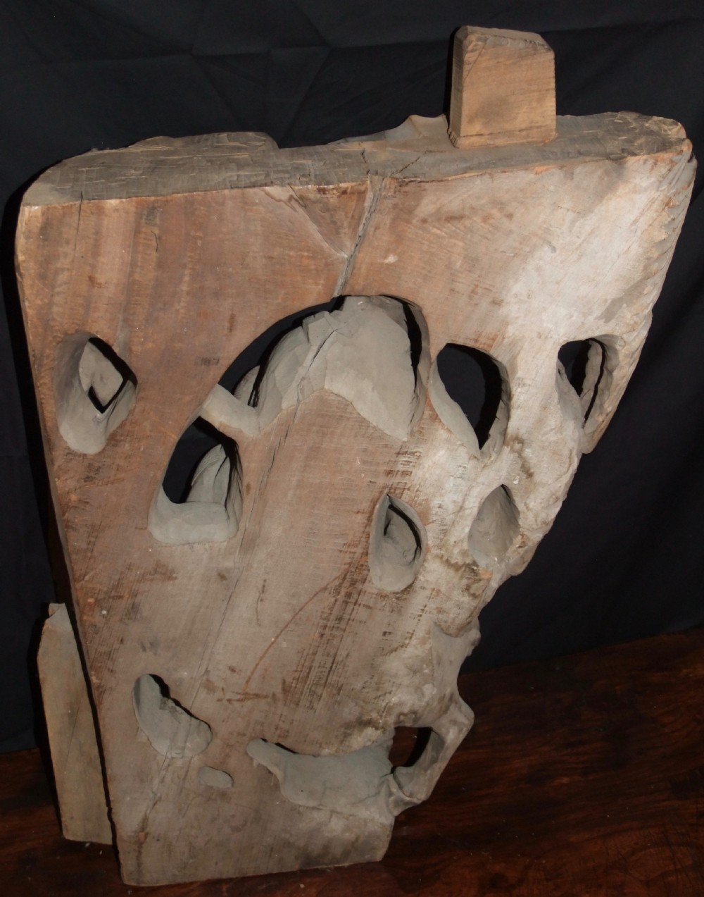 A pair of deeply carved natural timber architectural corbels depicting figures mounted on horses amidst floral motifs. View XIX
