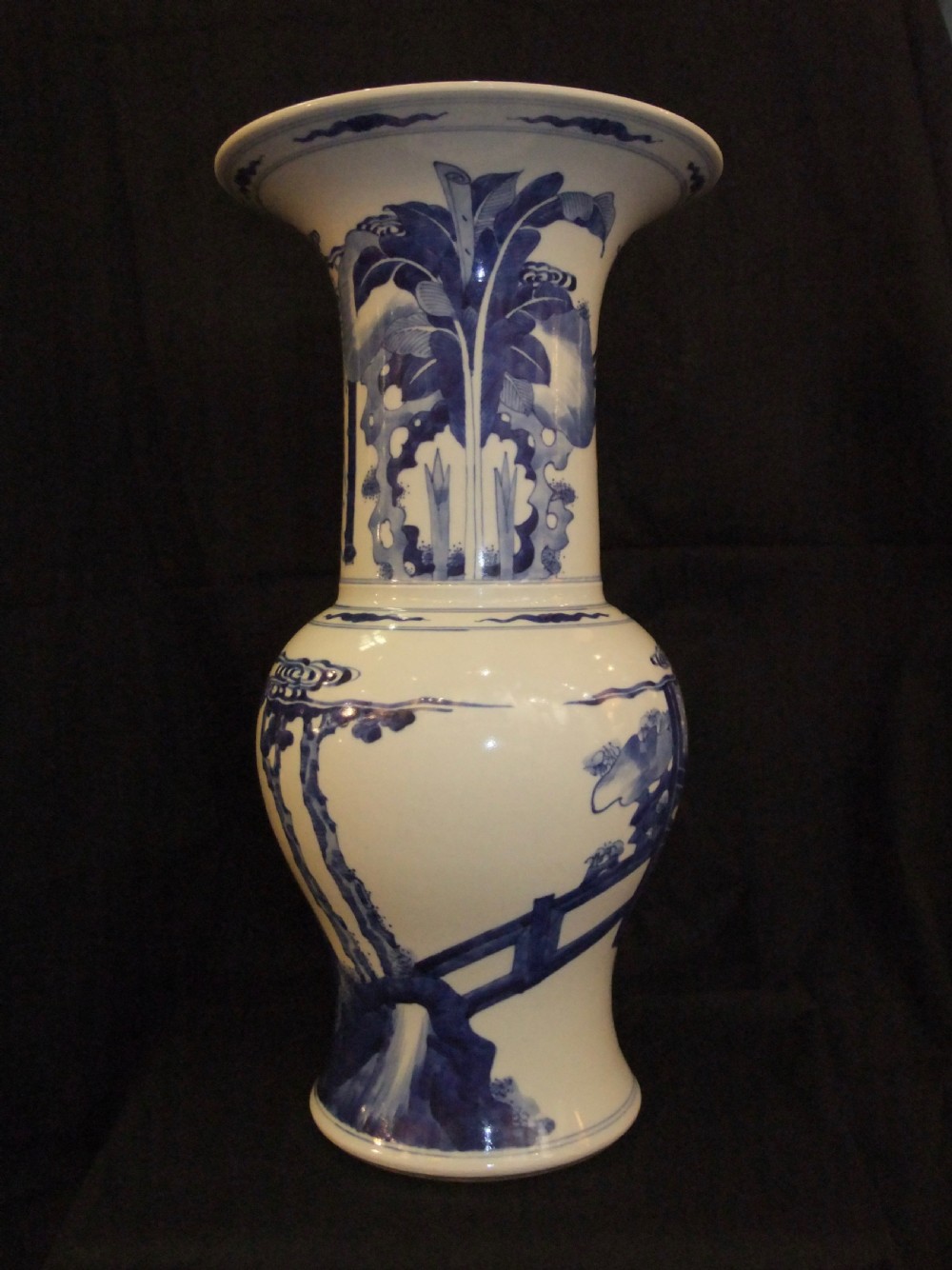 An antique Chinese blue and white porcelain Yen Yen vase featuring a flared trumpet rim and narrative figurative panels painted in underglaze cobalt blue. View III