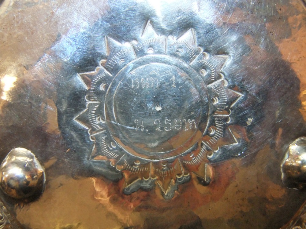 A 19th-century Burmese footed silver bowl featuring high-relief repousse decoration depicting figures, animals, and trees. View IX