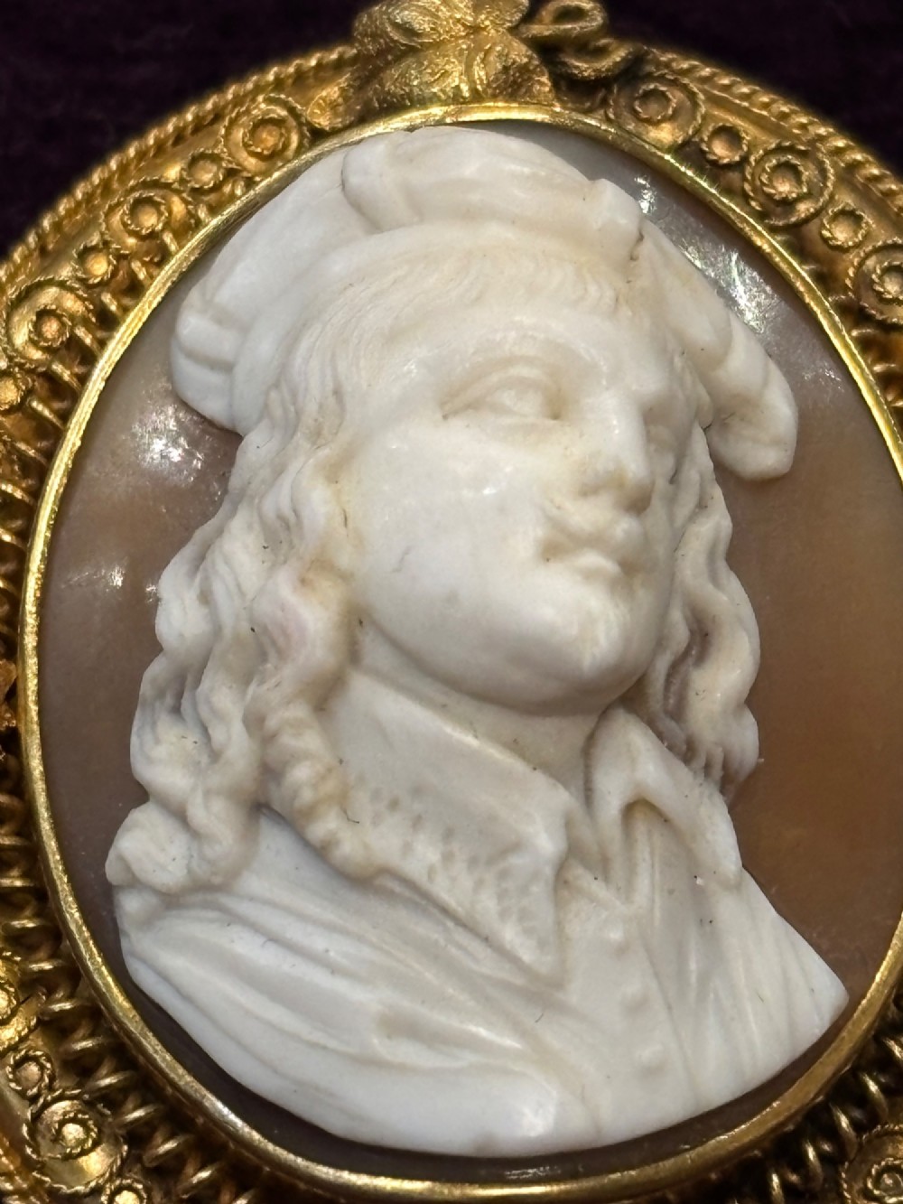 An oval early Victorian shell cameo featuring a carved relief portrait of Bonnie Prince Charlie within an intricate gold filigree border and safety chain. View III
