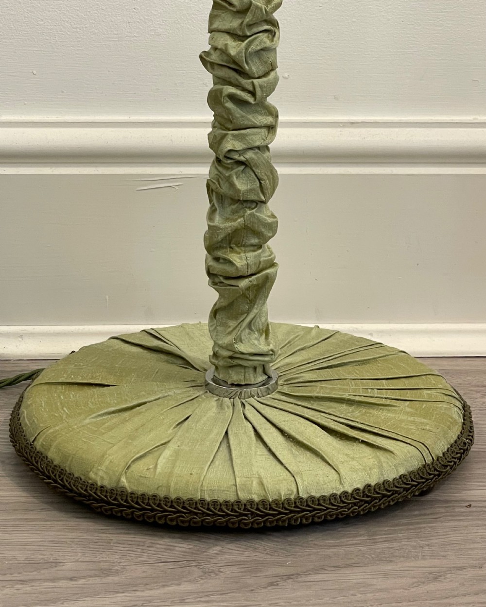 A 1930s standard lamp with gathered sage green silk fabric covering the central column and circular base, topped with a chrome bulb fitting. View IV