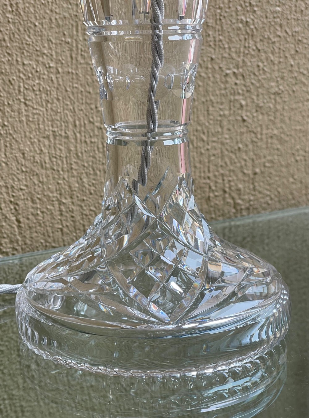 A clear cut crystal mushroom table lamp featuring diamond-patterned facets on the domed shade and a matching central stem. View V