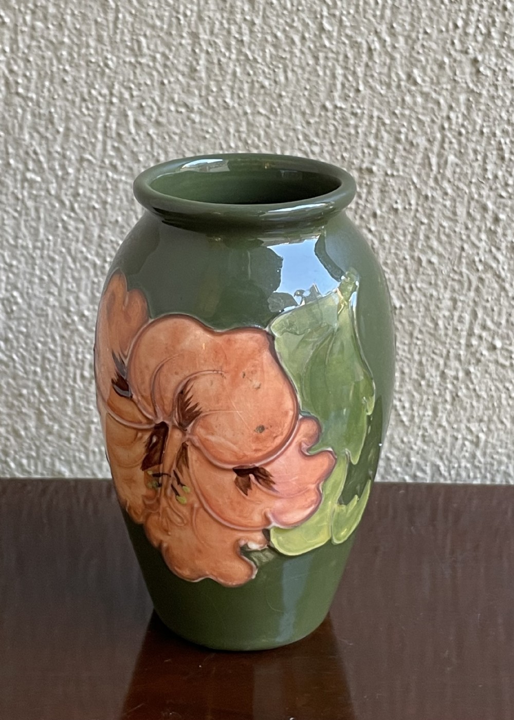 Moorcroft Coral Hibiscus Vase on Olive Green Background