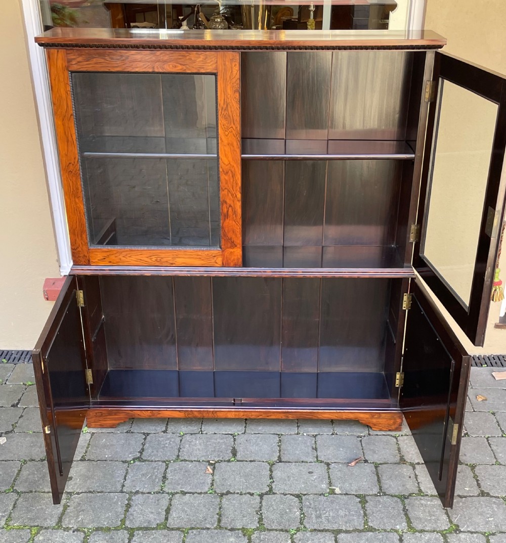 Nineteenth-century two-tier rosewood cabinet with upper glazed double doors and lower solid panel doors framed by beaded trim. View V