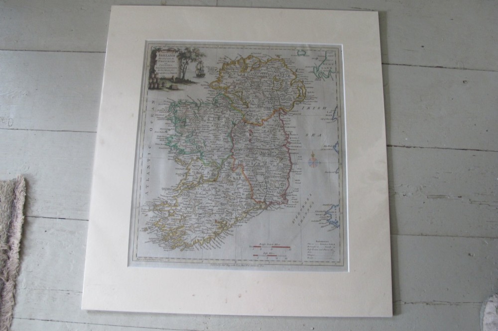 An eighteenth-century hand-coloured engraved map of Ireland presented within a broad off-white card mount.
