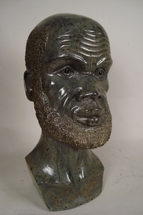 a large 1930's statue of an african man - CATEGORY: ANTIQUE MISCELLANEOUS - DATED 1930