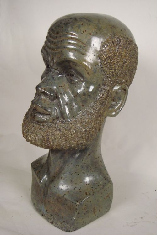 A LARGE 1930'S STATUE OF AN AFRICAN MAN - ADDITIONAL PHOTO 2