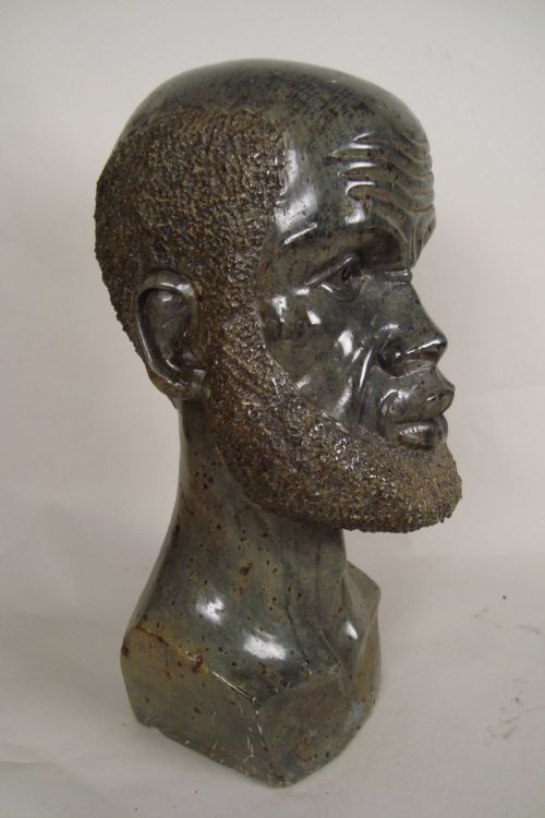 A LARGE 1930'S STATUE OF AN AFRICAN MAN - ADDITIONAL PHOTO 3