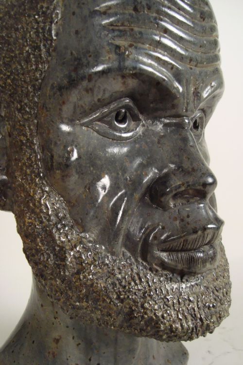 A LARGE 1930'S STATUE OF AN AFRICAN MAN - ADDITIONAL PHOTO 4