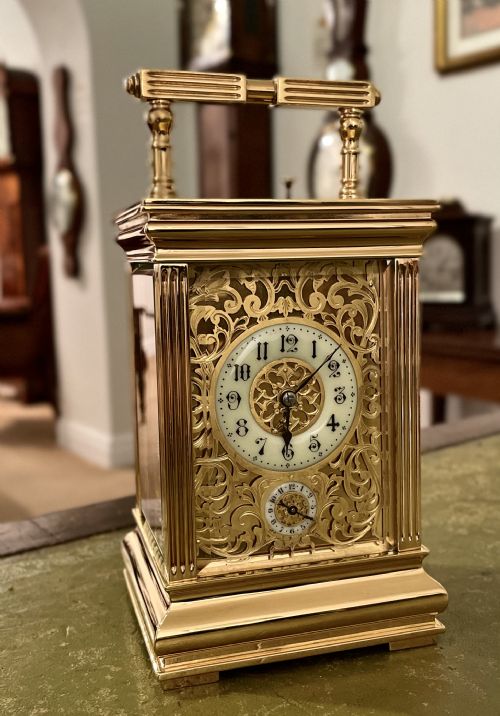 French Carriage Clock with Elaborate Gilt Case
